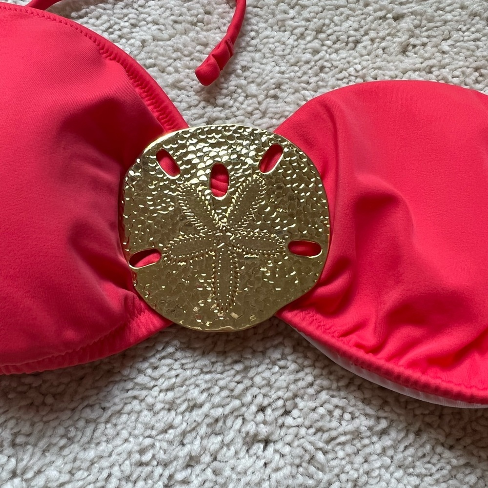 NWOT. Victoria’s Secret bikini top. Coral colored . Sized M